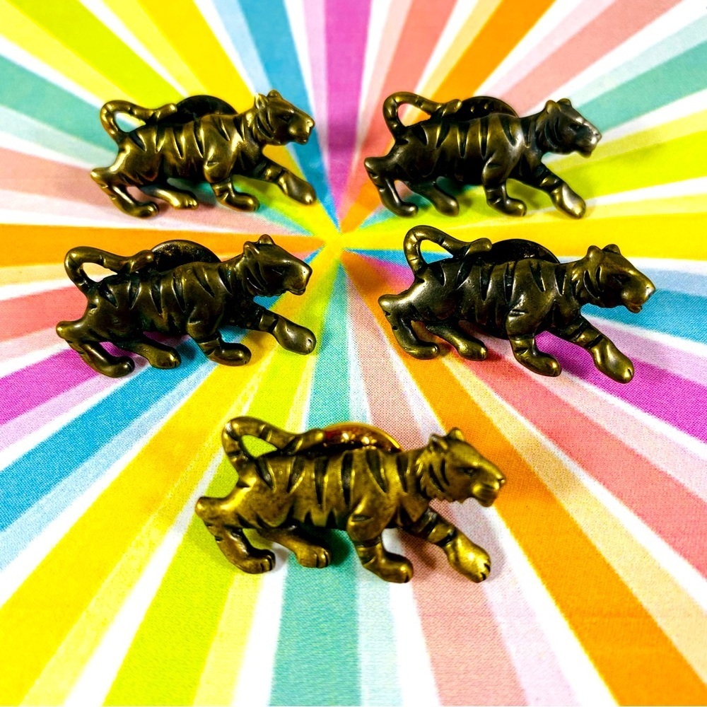 Cool little vintage brass tiger pins